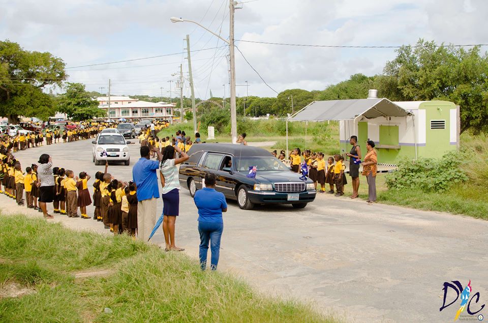 School Children lining the street to pay tribute to Mr. Ronald Webster