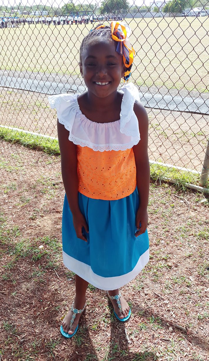 Anguilla Day 2015 Parade. Cute girl wearing Anguilla colours.